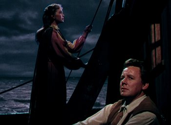 Movie still from “Plymouth Adventure” (1952), directed by Clarence Brown – A man and a woman on a boat in the ocean; Medium shot, Low angle