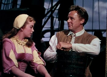 Movie still from “Plymouth Adventure” (1952), directed by Clarence Brown – A man and a woman are dressed in old - fashioned clothing; Medium shot, Over the shoulder angle