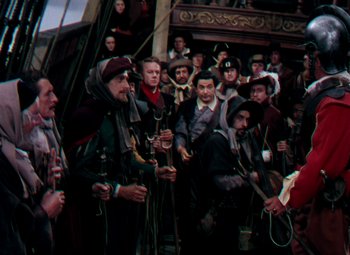 Movie still from “Plymouth Adventure” (1952), directed by Clarence Brown – A group of people standing on top of a wooden structure; Wide shot, High angle