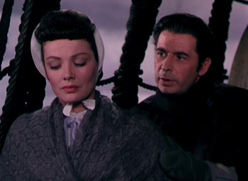 Movie still from “Plymouth Adventure” (1952), directed by Clarence Brown – A man and a woman are standing next to each other; Close Up shot, Low angle