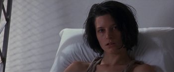 Movie still from “Point of No Return” (1993), directed by John Badham – A person laying in a bed; Close Up shot, Low angle