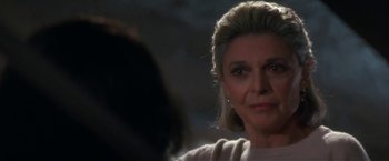 Movie still from “Point of No Return” (1993), directed by John Badham – A person looking at the camera; Close Up shot, Over the shoulder angle