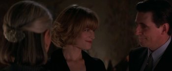 Movie still from “Point of No Return” (1993), directed by John Badham – A person wearing a black jacket; Close Up shot, Over the shoulder angle