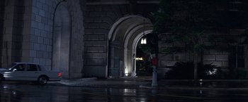 Movie still from “Point of No Return” (1993), directed by John Badham – A fire hydrant in front of an arched doorway; Wide shot, Low angle