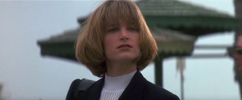 Movie still from “Point of No Return” (1993), directed by John Badham – A person wearing a jacket; Close Up shot, Low angle