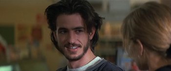 Movie still from “Point of No Return” (1993), directed by John Badham – A person with long black hair; Close Up shot, Over the shoulder angle