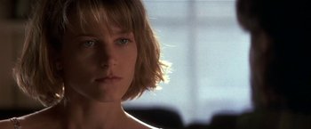 Movie still from “Point of No Return” (1993), directed by John Badham – A person with short blonde hair; Close Up shot, Low angle