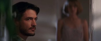 Movie still from “Point of No Return” (1993), directed by John Badham – A man and a woman looking at each other; Close Up shot, Over the shoulder angle