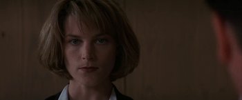 Movie still from “Point of No Return” (1993), directed by John Badham – A person with short hair; Close Up shot, Low angle
