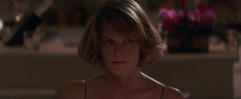Movie still from “Point of No Return” (1993), directed by John Badham – A person with short brown hair; Close Up shot, Low angle