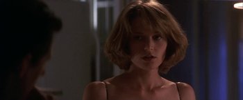 Movie still from “Point of No Return” (1993), directed by John Badham – A person with short brown hair; Close Up shot, Low angle