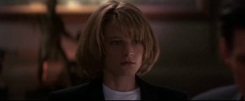 Movie still from “Point of No Return” (1993), directed by John Badham – A person wearing a jacket; Close Up shot, Low angle