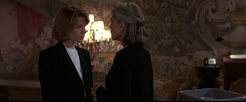 Movie still from “Point of No Return” (1993), directed by John Badham – Two women are standing in a room talking to each other; Medium shot, Over the shoulder angle