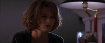 Movie still from “Point of No Return” (1993), directed by John Badham – A person with short brown hair; Close Up shot, Low angle