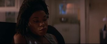 Movie still from “Point of No Return” (1993), directed by John Badham – A person sitting in a chair; Close Up shot, High angle