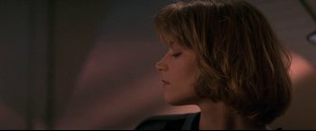 Movie still from “Point of No Return” (1993), directed by John Badham – A person with her eyes closed; Close Up shot, Low angle