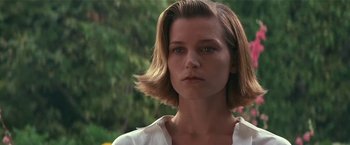 Movie still from “Point of No Return” (1993), directed by John Badham – A person with short brown hair; Close Up shot, Low angle