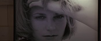 Movie still from “Point of No Return” (1993), directed by John Badham – A woman's face with her hand on her head; Extreme Close Up shot, Low angle