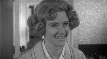 Movie still from “Poison” (1991), directed by Todd Haynes – An old photo of an older woman with curlers in her hair; Close Up shot, Over the shoulder angle