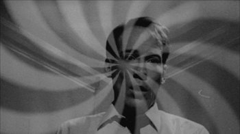 Movie still from “Poison” (1991), directed by Todd Haynes – A black - and - white photo of a man's face with rays coming out of it; Close Up shot, Low angle