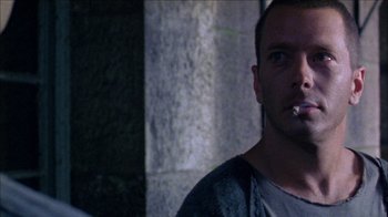 Movie still from “Poison” (1991), directed by Todd Haynes – A person smoking a cigarette; Close Up shot, Low angle