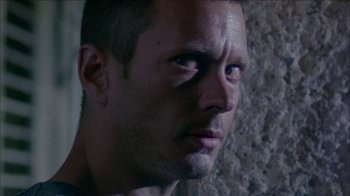 Movie still from “Poison” (1991), directed by Todd Haynes – A person looking at the camera; Close Up shot, Low angle