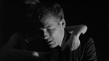 Movie still from “Poison” (1991), directed by Todd Haynes – A black and white photo of a man and a woman; Close Up shot, Low angle