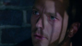 Movie still from “Poison” (1991), directed by Todd Haynes – A person with green eyes; Extreme Close Up shot, High angle