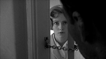 Movie still from “Poison” (1991), directed by Todd Haynes – A woman is looking at herself in the mirror; Close Up shot, Over the shoulder angle