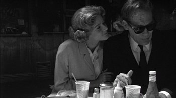 Movie still from “Poison” (1991), directed by Todd Haynes – A man and a woman sitting at a dinner table; Medium shot, Over the shoulder angle