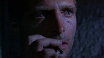Movie still from “Poison” (1991), directed by Todd Haynes – A man smoking a cigarette; Extreme Close Up shot, Low angle