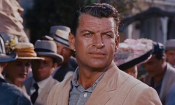 Movie still from “Pollyanna” (1960), directed by David Swift – A person wearing a suit and hat; Close Up shot, Over the shoulder angle