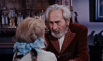 Movie still from “Pollyanna” (1960), directed by David Swift – An old man and a young girl talking to each other; Close Up shot, Over the shoulder angle