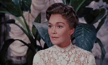 Movie still from “Pollyanna” (1960), directed by David Swift – A person wearing a white dress; Close Up shot, Over the shoulder angle