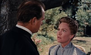 Movie still from “Pollyanna” (1960), directed by David Swift – A man and a woman talking to each other; Close Up shot, Over the shoulder angle