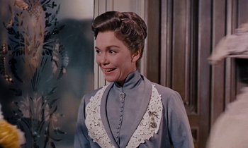 Movie still from “Pollyanna” (1960), directed by David Swift – An older woman wearing a blue dress with a white lace collar; Close Up shot, Over the shoulder angle