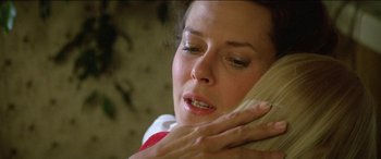 Movie still from “Poltergeist” (1982), directed by Tobe Hooper – A person talking on a phone; Close Up shot, Over the shoulder angle