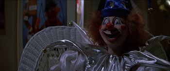 Movie still from “Poltergeist” (1982), directed by Tobe Hooper – A clown's face in a basket; Medium shot, Over the shoulder angle