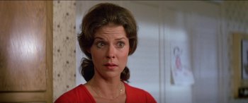 Movie still from “Poltergeist” (1982), directed by Tobe Hooper – A person wearing a red shirt; Close Up shot, Low angle