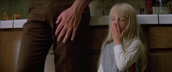 Movie still from “Poltergeist” (1982), directed by Tobe Hooper – A young girl and an older man in a room; Close Up shot, Low angle