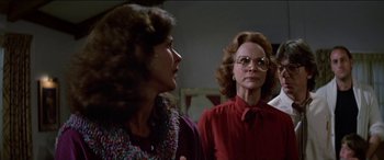 Movie still from “Poltergeist” (1982), directed by Tobe Hooper – Two women are standing next to each other in a room; Medium shot, Over the shoulder angle