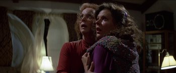 Movie still from “Poltergeist” (1982), directed by Tobe Hooper – Two women looking up at the ceiling in a room; Close Up shot, Low angle