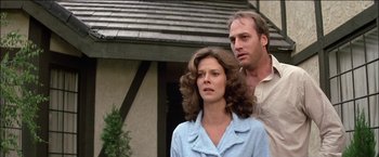Movie still from “Poltergeist” (1982), directed by Tobe Hooper – A man and a woman standing next to each other outside; Close Up shot, Low angle