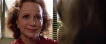 Movie still from “Poltergeist” (1982), directed by Tobe Hooper – An older woman is looking into the camera; Close Up shot, Over the shoulder angle