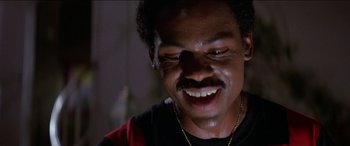 Movie still from “Poltergeist” (1982), directed by Tobe Hooper – A person with a smile on their face; Close Up shot, Low angle