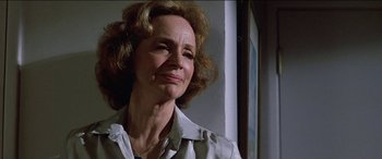 Movie still from “Poltergeist” (1982), directed by Tobe Hooper – An older woman is looking off into the distance; Close Up shot, Low angle