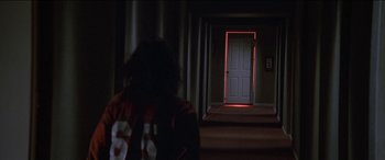 Movie still from “Poltergeist” (1982), directed by Tobe Hooper – A woman walking down the hall way of a house; Wide shot, High angle