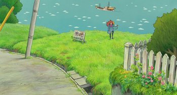 Movie still from “Ponyo” (2008), directed by Hayao Miyazaki – A person standing on top of a grass covered field next to a body of water; Extreme Wide shot, High angle
