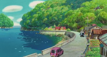 Movie still from “Ponyo” (2008), directed by Hayao Miyazaki – An illustration of a car driving down a road next to a lake; Extreme Wide shot, High angle