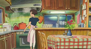Movie still from “Ponyo” (2008), directed by Hayao Miyazaki – A woman is holding a frying pan in a kitchen; Wide shot, Low angle